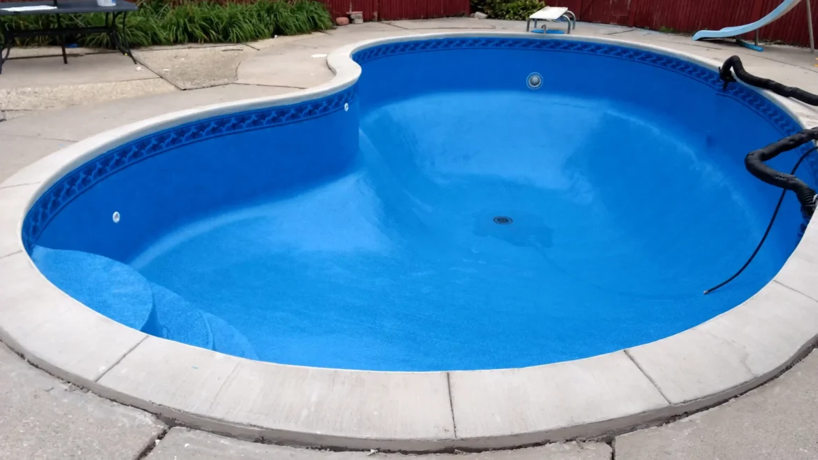 Closeup shot of the filling water in swimming pool