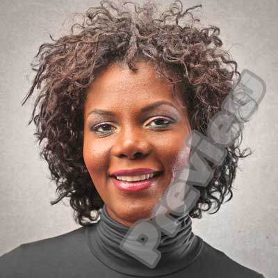 Headshot of a woman with curly hair